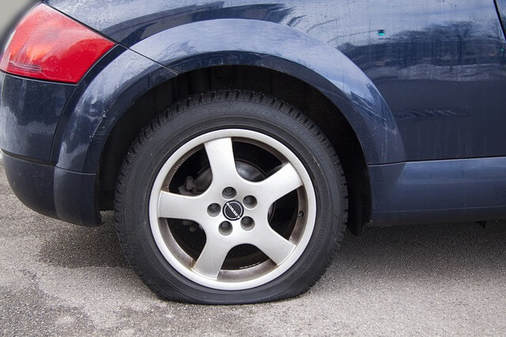 Volkswagen with flat tire in San Tan, Arizona