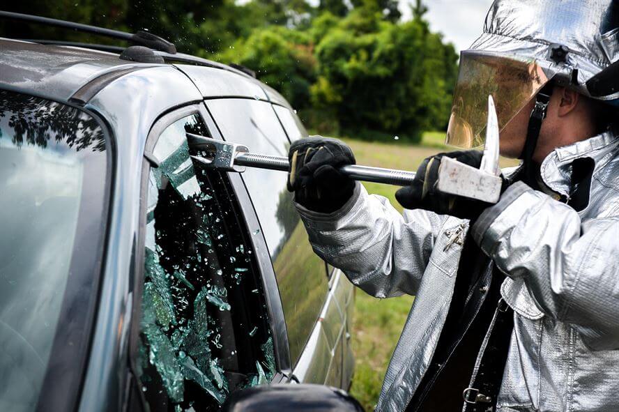 Man Breaking Car Window